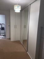 Small hinged wardrobe to help maximise the avaliable space