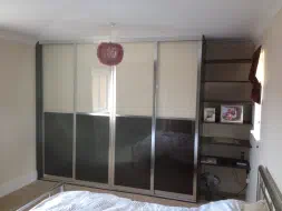 Split design with black and cream glass in a polished silver frame, fitted in Hartlepool