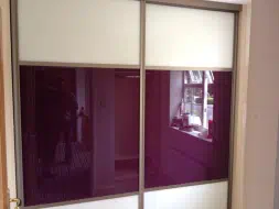 Large fuchsia pink glass panels in light bronze frames brightening up the room - fitted in Seaton Carew