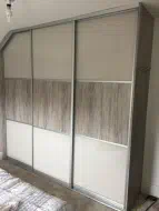 Pearl White glass with light artwood split into 3 equal sections in a brushed silver frame, instlled in Whitby