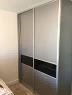 Black glass used to split the panels in a brushed silver frame, fitted in Yarm