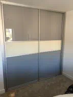 Stone grey with a pearl white glass dividing strip, fitted in Stockton