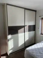 Mocha glass separating woodgrain white panels, fitted in Redcar