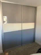 Light brown with a cream dividing strip in brushed silver frames, fitted in Kirklevington