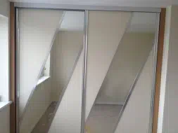 Diagonal split sliding doors in posihed silver frames