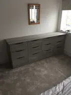 Built-in dark artwood 4 x 3 drawer unit, fitted in Whitby
