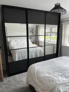 Sliding doors divided into 5 equal splits with top and bottom having black panel and the rest having mirror, fitted in Seaton Carew